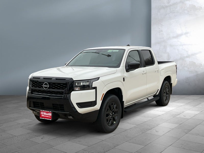 2026 Nissan Frontier Crew Cab SV in Glacier White — front three-quarter view