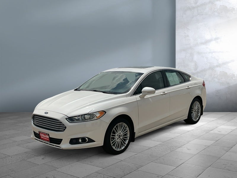 2016 Ford Fusion SE in Deep Impact Blue — front three-quarter view