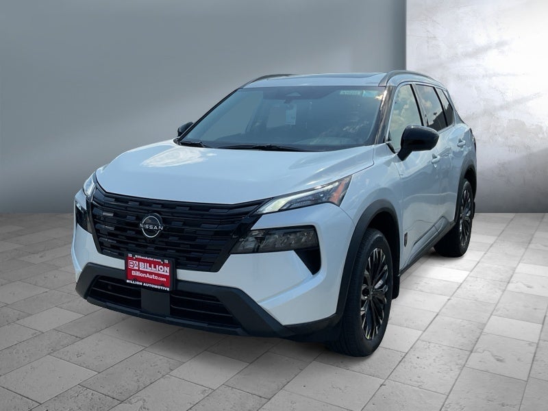 2026 Nissan Rogue Dark Armor in Everest White Pearl Tricoat — front three-quarter view